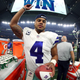 Dak Prescott of the Dallas Cowboys celebrates after the Dallas Cowboys beat the New York Giants 19-3 at AT&T Stadium on September 10, 2017 in Arlington, Texas.